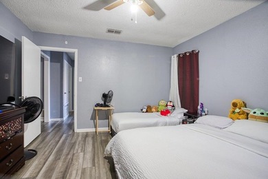 This spacious three-bedroom home features four-sided brick, a - photo 16