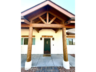 With a gorgeous backdrop of Granite Mountain, this Prescott home
