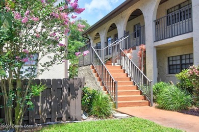 Lovely second floor condo tucked along the edge of lush - photo 1