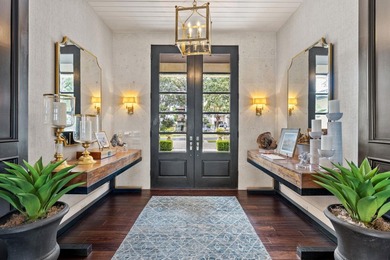 Nestled along the coveted waterfront on Lighthouse Drive in - photo 4