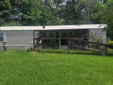 Discover peaceful living near the water with this 2-bedroom - photo 1