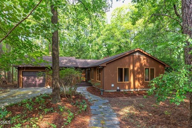 Tucked away on a sprawling corner lot of over 1/2 an acre in the - photo 1