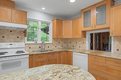 Tucked away on a sprawling corner lot of over 1/2 an acre in the - photo 3