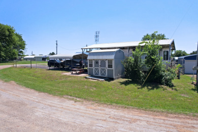 Lot in Gated Waterfront Community on Lake Fork, RV, carport, shed - photo 3