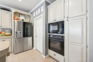 Welcome to this charming patio home nestled within the gated