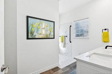 Welcome to this charming patio home nestled within the gated