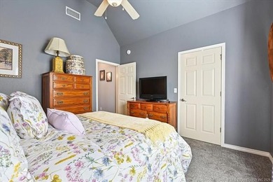 Welcome to this charming patio home nestled within the gated