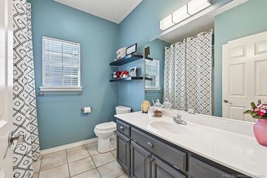 Welcome to this charming patio home nestled within the gated