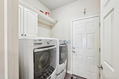 Welcome to this charming patio home nestled within the gated