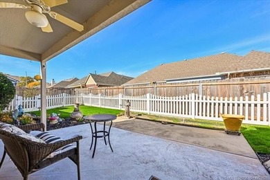 Welcome to this charming patio home nestled within the gated