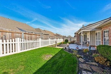 Welcome to this charming patio home nestled within the gated
