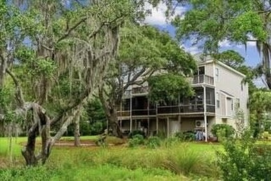 Nestled beneath a canopy of moss-draped grand oaks, where the - photo 40