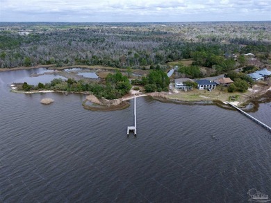 Waterfront lot on Escambia Bay offering direct access to the - photo 9