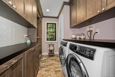 Nestled on two private, professionally landscaped acres in the - photo 27