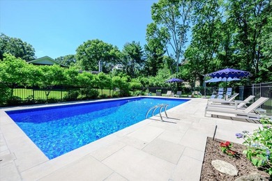 Nestled on two private, professionally landscaped acres in the - photo 32