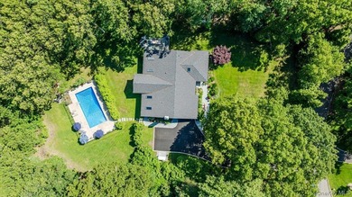 Nestled on two private, professionally landscaped acres in the - photo 41