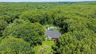 Nestled on two private, professionally landscaped acres in the - photo 42