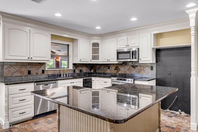 Set on 2.36 acres shaded by beautiful oak trees, this Gulfport - photo 13