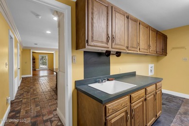 Set on 2.36 acres shaded by beautiful oak trees, this Gulfport - photo 26