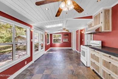 Set on 2.36 acres shaded by beautiful oak trees, this Gulfport - photo 29