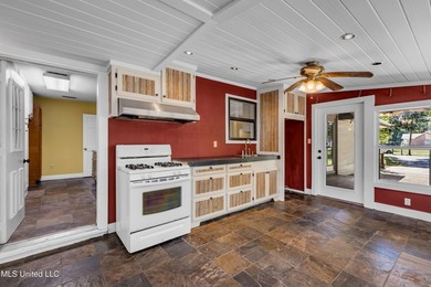 Set on 2.36 acres shaded by beautiful oak trees, this Gulfport - photo 30