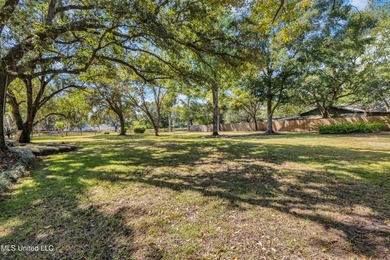 Set on 2.36 acres shaded by beautiful oak trees, this Gulfport - photo 32