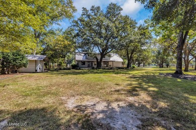 Set on 2.36 acres shaded by beautiful oak trees, this Gulfport - photo 33