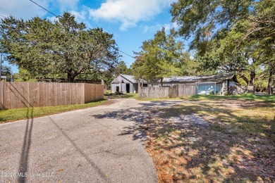 Set on 2.36 acres shaded by beautiful oak trees, this Gulfport - photo 35