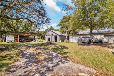 Set on 2.36 acres shaded by beautiful oak trees, this Gulfport - photo 36