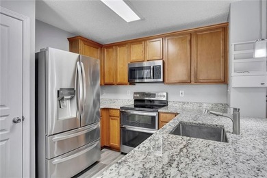 Located in Victoria Crossing, this end-unit townhome offers - photo 12