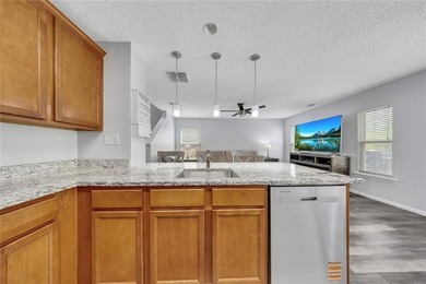 Located in Victoria Crossing, this end-unit townhome offers - photo 13