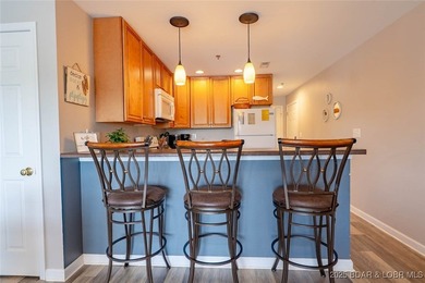 Welcome to this beautifully remodeled, walk-in end unit at The - photo 9