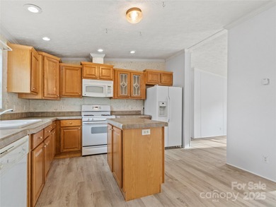 Tucked away on a beautiful 1.06-acre lot, this home invites you