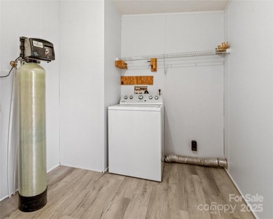 Tucked away on a beautiful 1.06-acre lot, this home invites you