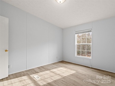 Tucked away on a beautiful 1.06-acre lot, this home invites you