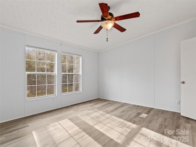 Tucked away on a beautiful 1.06-acre lot, this home invites you