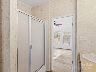 Tucked away on a beautiful 1.06-acre lot, this home invites you