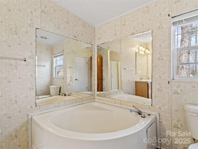 Tucked away on a beautiful 1.06-acre lot, this home invites you