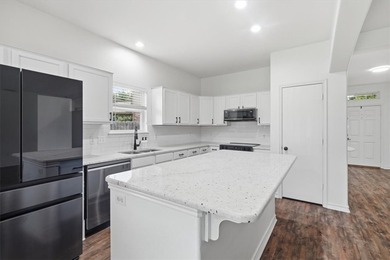 NEWLY renovated four-bedroom,two-bathroom split-plan home with - photo 8