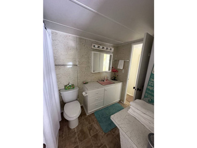 Charming vintage 2-bedroom, 1-bath mobile home located on an - photo 11