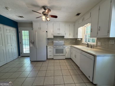 Welcome home to this charming, single-level ranch in The - photo 14