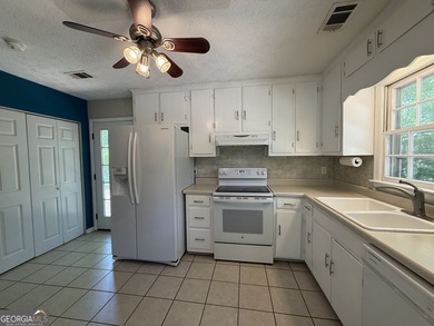 Welcome home to this charming, single-level ranch in The - photo 16