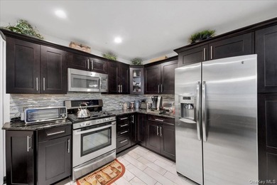 WELCOME HOME!! This charming brick Cape Cod with - photo 18