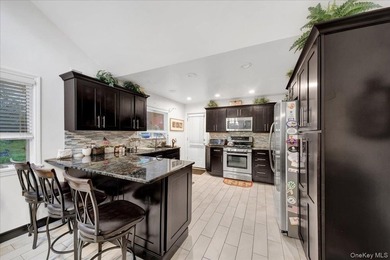 WELCOME HOME!! This charming brick Cape Cod with - photo 21