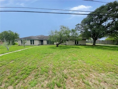 This four-side brick home in Rolling Acres subdivision has a lot - photo 2
