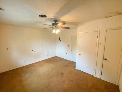 This four-side brick home in Rolling Acres subdivision has a lot - photo 8