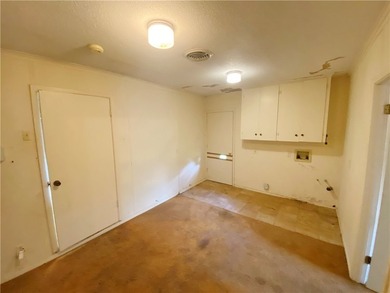 This four-side brick home in Rolling Acres subdivision has a lot - photo 10