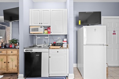 Welcome to this charming efficiency condo in the highly - photo 14