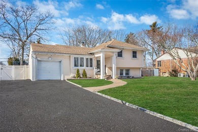 Step inside this exceptional split-level residence, From the - photo 1