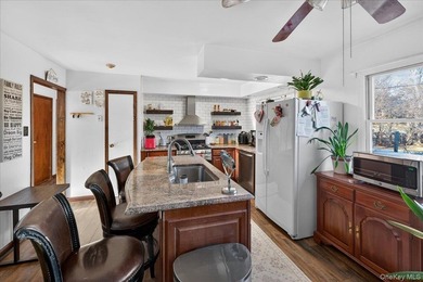 Welcome to this spacious and versatile home set on an oversized - photo 5
